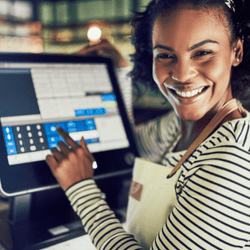 woman on desktop pos system