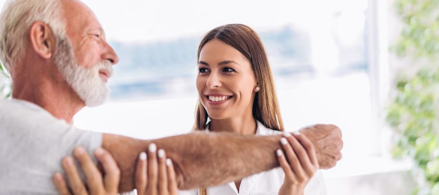 image of chiropractic doctor helping man stretch